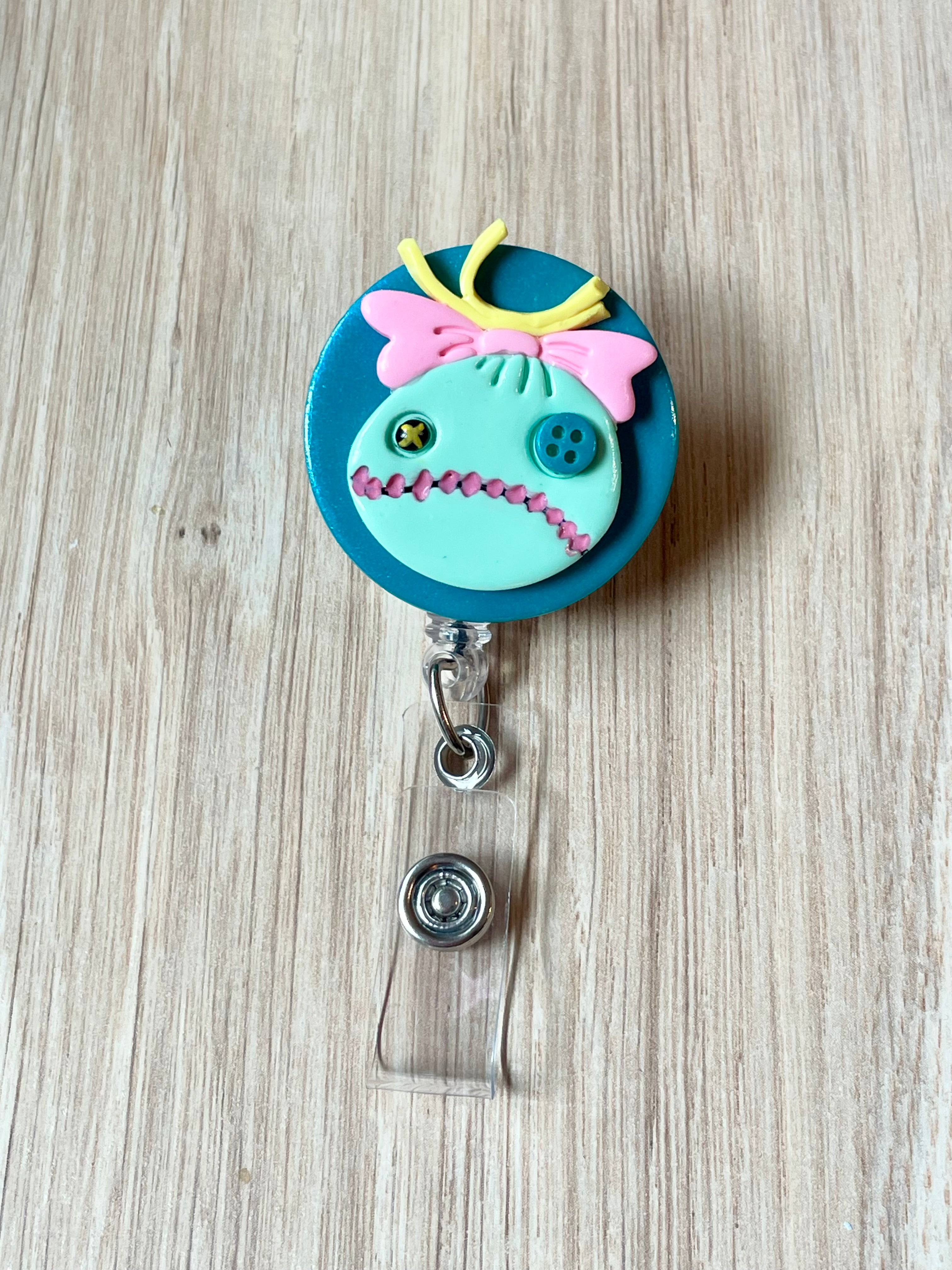 Girl’s Doll Badge Reel